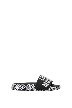 Love Moschino Slippers and clogs Women PVC Black White