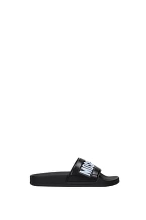 Moschino Slippers and clogs Women PVC Black