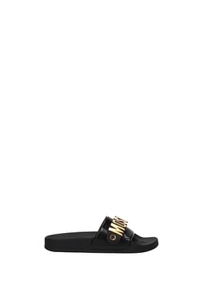 Moschino Slippers and clogs Women PVC Black